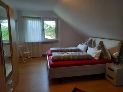 Ein Bett oder Betten in einem Zimmer der Unterkunft Ferienwohnungen Nibelungenwald