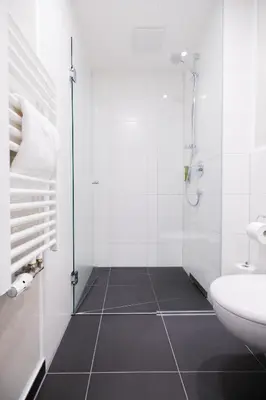 Ein Badezimmer in der Unterkunft GuestHouse Speyer
