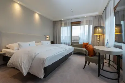 Ein Bett oder Betten in einem Zimmer der Unterkunft Insel-Hotel Heilbronn