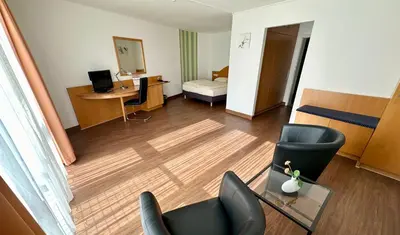 Ein Bett oder Betten in einem Zimmer der Unterkunft Asgard Hotel