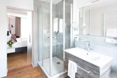 Ein Badezimmer in der Unterkunft Adler Landhotel