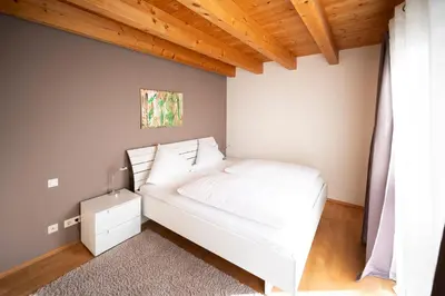Ein Bett oder Betten in einem Zimmer der Unterkunft Adler Landhotel