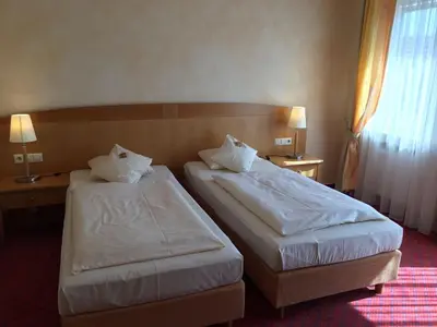 Ein Bett oder Betten in einem Zimmer der Unterkunft Businesshotel HEILBRONN- Biberach