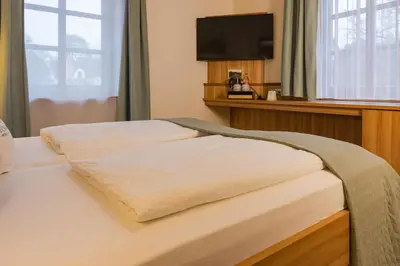 Ein Bett oder Betten in einem Zimmer der Unterkunft Hotel Neckarblick