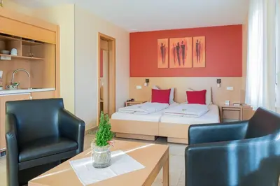 Ein Bett oder Betten in einem Zimmer der Unterkunft Muellers Weingut und Weinstube im Auerberg