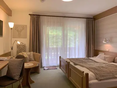 Ein Bett oder Betten in einem Zimmer der Unterkunft Landhotel Untere Kapfenhardter Mühle