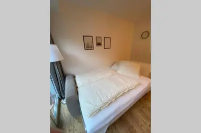 Ein Bett oder Betten in einem Zimmer der Unterkunft SUNSIDE Idyllisches Apartment am Wasser