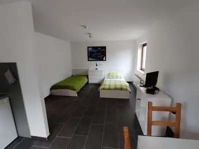Ein Bett oder Betten in einem Zimmer der Unterkunft Ferienwohnung Kerstin Grambow