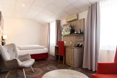 Ein Sitzbereich in der Unterkunft Hotel Engelhorn