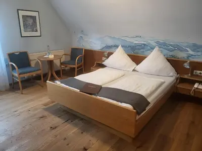 Ein Bett oder Betten in einem Zimmer der Unterkunft Brauereigasthof Dachsenfranz