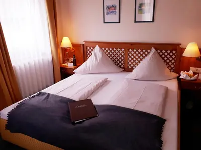 Ein Bett oder Betten in einem Zimmer der Unterkunft Brauereigasthof Dachsenfranz