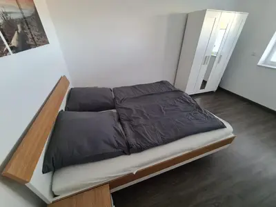Ein Bett oder Betten in einem Zimmer der Unterkunft 1,5 ZKB Wohnung im Odenwald, an der Bergstraße mit tollem Ausblick