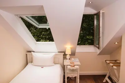 Ein Bett oder Betten in einem Zimmer der Unterkunft Hotel Villa Marstall