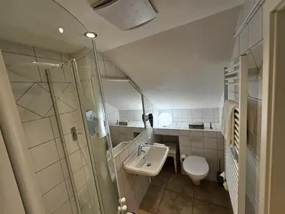 Ein Badezimmer in der Unterkunft Hotel Villa Marstall