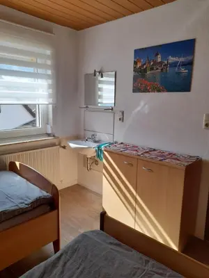 Ein Bett oder Betten in einem Zimmer der Unterkunft Ferienwohnung am Brunnen