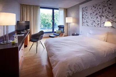 Ein Bett oder Betten in einem Zimmer der Unterkunft Parkhotel Pforzheim