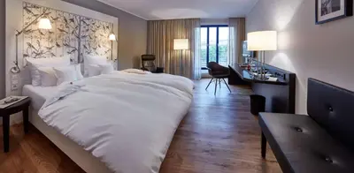Ein Bett oder Betten in einem Zimmer der Unterkunft Parkhotel Pforzheim
