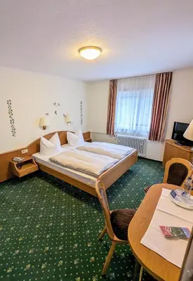 Ein Bett oder Betten in einem Zimmer der Unterkunft Hotel Fidelitas