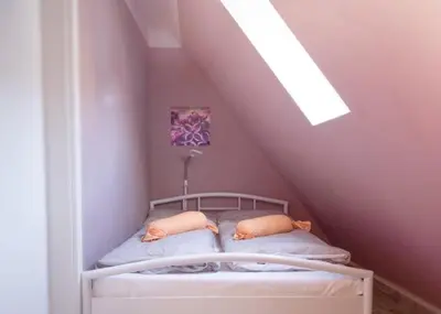 Ein Bett oder Betten in einem Zimmer der Unterkunft Historia Hotel