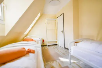 Ein Bett oder Betten in einem Zimmer der Unterkunft Historia Hotel