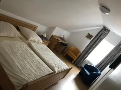 Ein Bett oder Betten in einem Zimmer der Unterkunft Pension Da Enzo