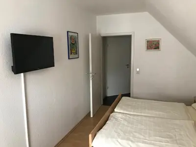 Ein Bett oder Betten in einem Zimmer der Unterkunft Pension Da Enzo
