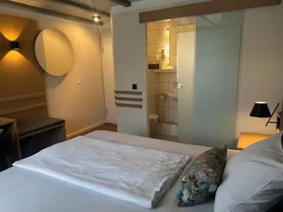 Ein Bett oder Betten in einem Zimmer der Unterkunft Gasthaus Zur Krone