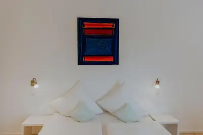 Ein Bett oder Betten in einem Zimmer der Unterkunft Hotel Barbarossa Karlsruhe Stadtmitte