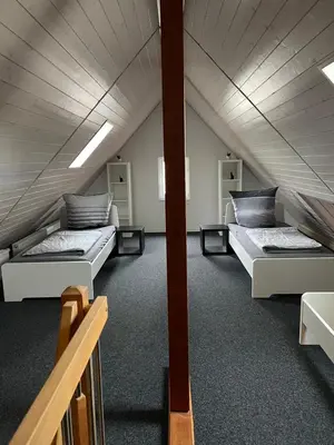 Ein Bett oder Betten in einem Zimmer der Unterkunft Ferienwohnung Sinsheim