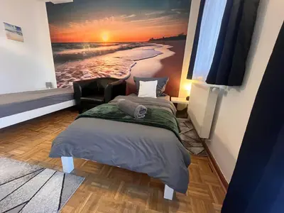 Ein Bett oder Betten in einem Zimmer der Unterkunft Grosses Apartment Aschaffenburg 4 Schlafzimmer für bis zu 11 Gäste AschaffApartment Mainaschaff