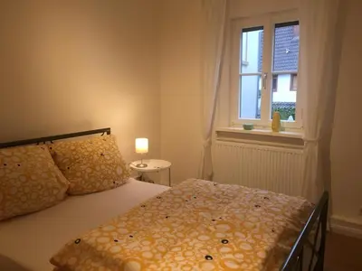 Ein Bett oder Betten in einem Zimmer der Unterkunft Turmwohnung Büdinger Hof