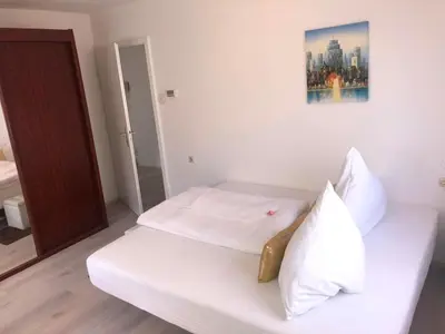 Ein Bett oder Betten in einem Zimmer der Unterkunft Pension mit Herz und Garten