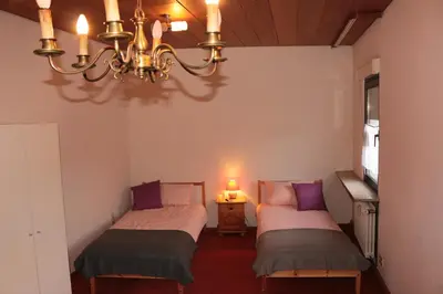 Ein Bett oder Betten in einem Zimmer der Unterkunft E Kurhaus Wohnung Nr 5