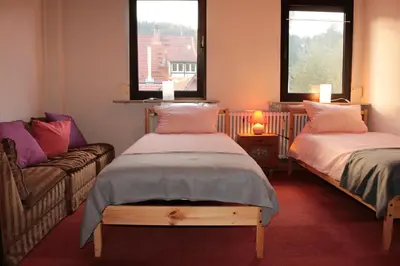 Ein Bett oder Betten in einem Zimmer der Unterkunft E Kurhaus Wohnung Nr 5