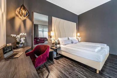 Ein Bett oder Betten in einem Zimmer der Unterkunft PLAZA INN Heilbronn