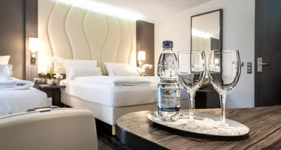 Ein Bett oder Betten in einem Zimmer der Unterkunft PLAZA INN Heilbronn