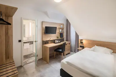 Ein Bett oder Betten in einem Zimmer der Unterkunft Best Western Hotel Favorit