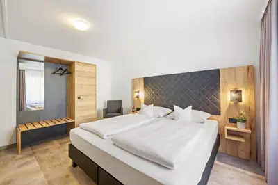 Ein Bett oder Betten in einem Zimmer der Unterkunft Best Western Hotel Favorit