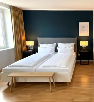 Ein Bett oder Betten in einem Zimmer der Unterkunft DK Hotel Heidelberg