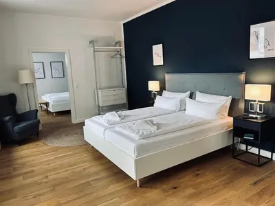 Ein Bett oder Betten in einem Zimmer der Unterkunft DK Hotel Heidelberg