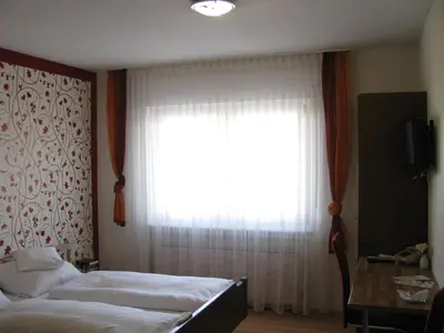 Ein Bett oder Betten in einem Zimmer der Unterkunft Hotel Bürgerstube