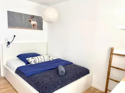 Ein Bett oder Betten in einem Zimmer der Unterkunft Ferienwohnung Schwarzwaldstraße