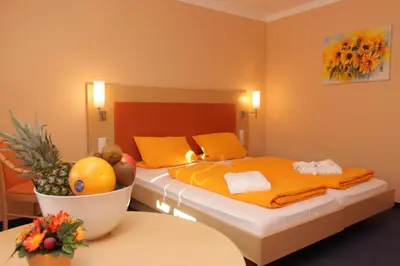 Ein Bett oder Betten in einem Zimmer der Unterkunft Hotel Linde Pfalz