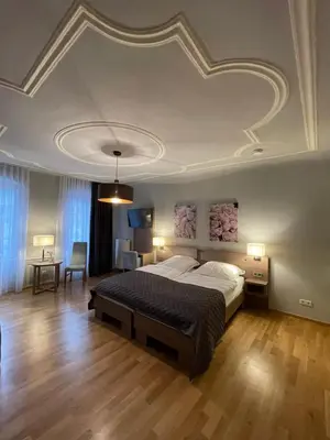 Ein Bett oder Betten in einem Zimmer der Unterkunft Boardinghouse Goethehaus