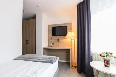 Ein Bett oder Betten in einem Zimmer der Unterkunft Hotel Freihof