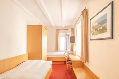 Ein Bett oder Betten in einem Zimmer der Unterkunft Hotel Centgraf