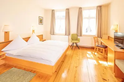 Ein Bett oder Betten in einem Zimmer der Unterkunft Hotel Centgraf