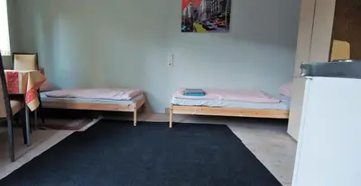 Ein Bett oder Betten in einem Zimmer der Unterkunft Kleines Studio 07, für den kurzen Aufenthalt