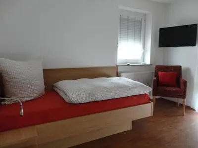 Ein Bett oder Betten in einem Zimmer der Unterkunft Ferienwohnung 2 in den Krautgärten