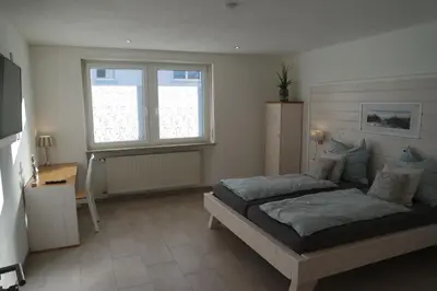 Ein Bett oder Betten in einem Zimmer der Unterkunft Pension Zweite Heimat